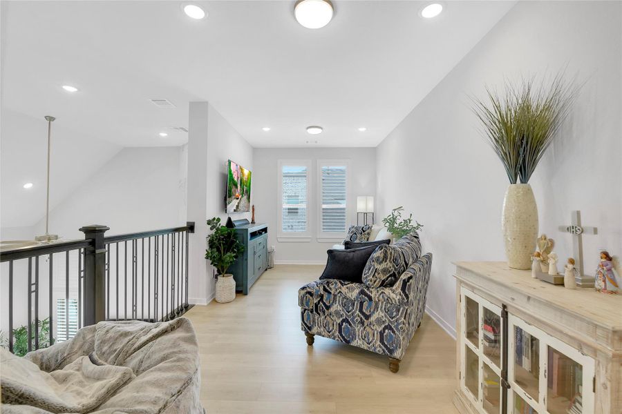Upstairs Loft and Gameroom Area with wood floors.