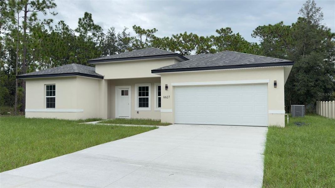 Front exterior of a new home in , Citrus Springs, FL, highlighting curb appeal (Image 2).
