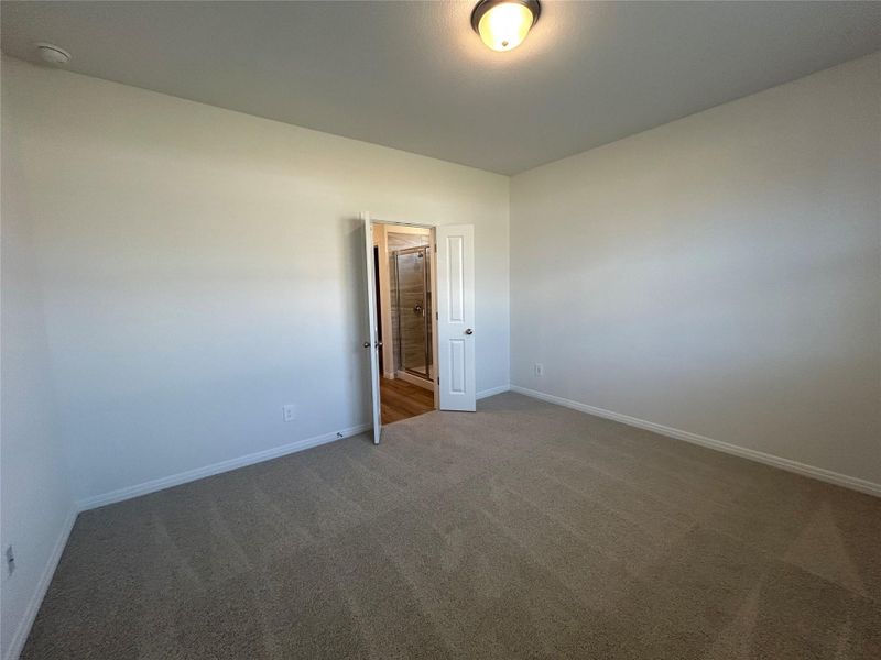 Empty room featuring carpet floors and baseboards Empty room featuring carpet floors and baseboards