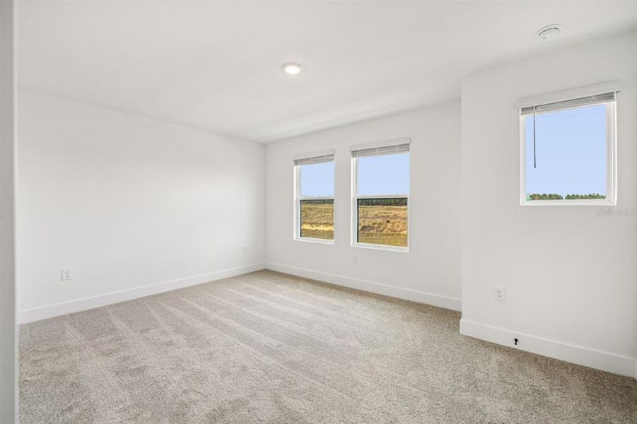 Spacious, unfurnished interior of a new home in Parkview at Hamlin, Winter Garden (Image 29).