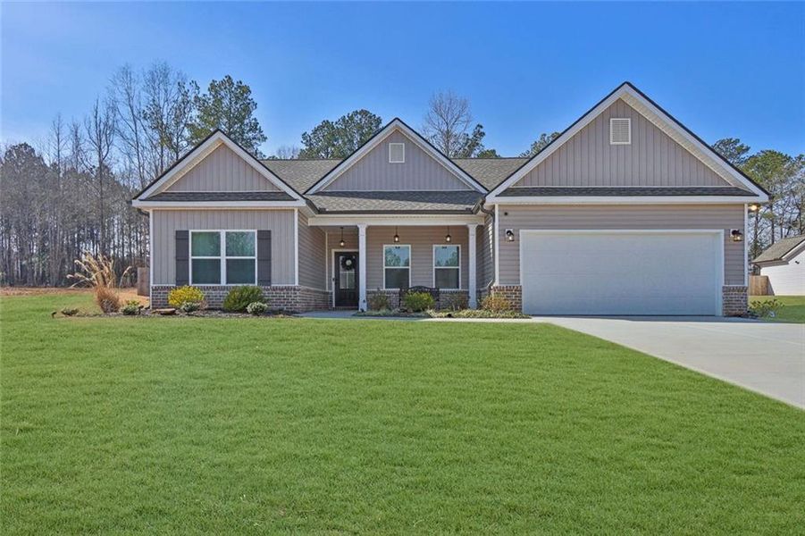 Front exterior of a new home in , Monroe, GA, highlighting curb appeal (Image 2). Front exterior of a new home in , Monroe, GA, highlighting curb appeal (Image 2).