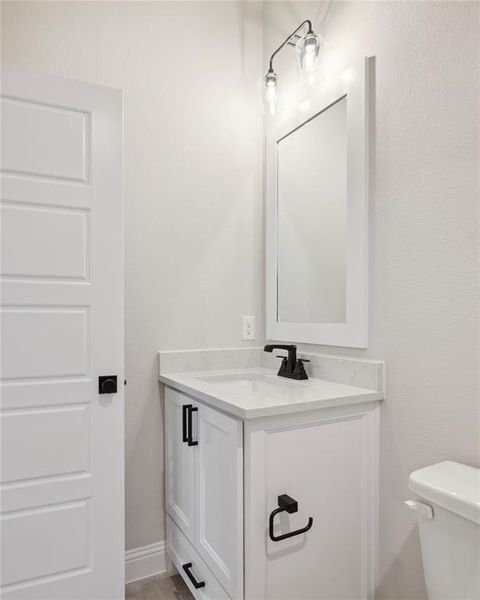 Bathroom with vanity and toilet