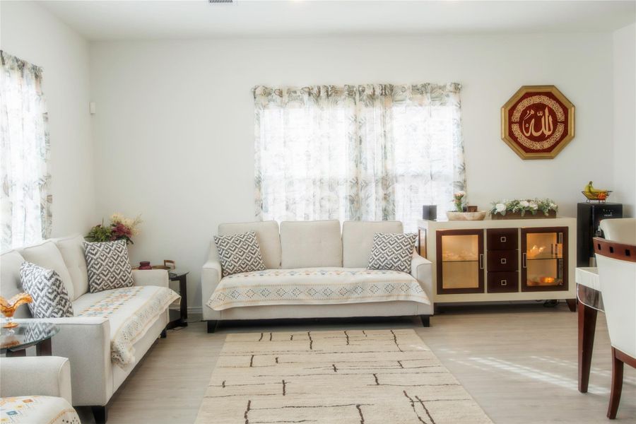 Spacious living room filled with natural light—bright, inviting, and ideal for everyday living or hosting guests.