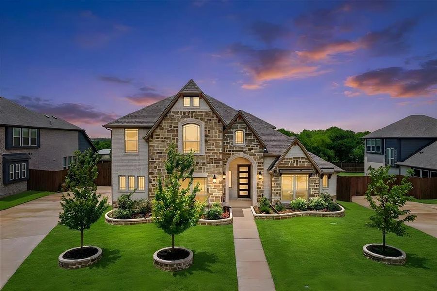 Front exterior of a new home in Wind Ridge, Midlothian, TX, highlighting curb appeal (Image 27). Front exterior of a new home in Wind Ridge, Midlothian, TX, highlighting curb appeal (Image 27).