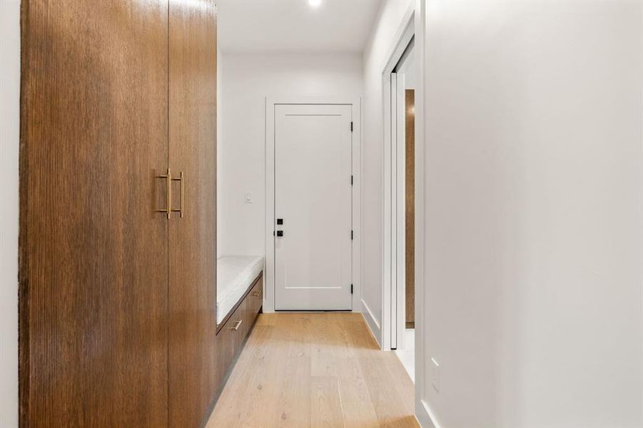 Corridor with light wood finished floors and baseboards Corridor with light wood finished floors and baseboards