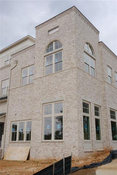 Front exterior of a new home in South on Main, Woodstock, GA, highlighting curb appeal (Image 7).