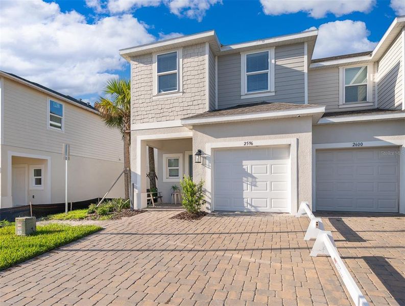 Exterior details and patio area of a home in Horse Creek at Crosswinds, Davenport (Image 2).