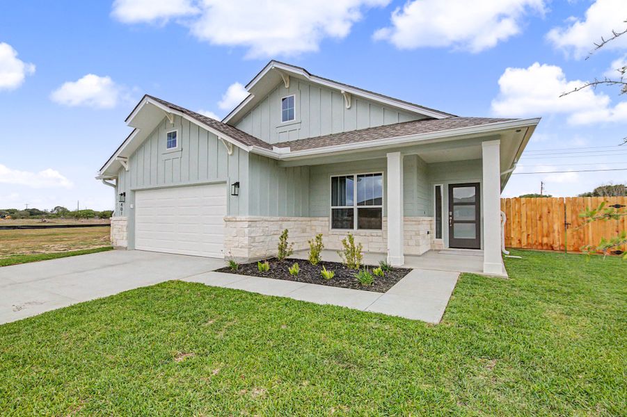 Front exterior of a new home in TerraVista, Victoria, TX, highlighting curb appeal (Image 28). Front exterior of a new home in TerraVista, Victoria, TX, highlighting curb appeal (Image 28).