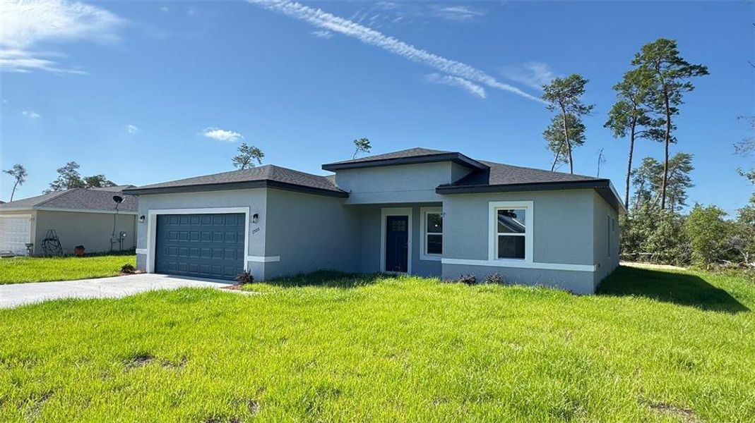 Front exterior of a new home in , Ocala, FL, highlighting curb appeal (Image 1).