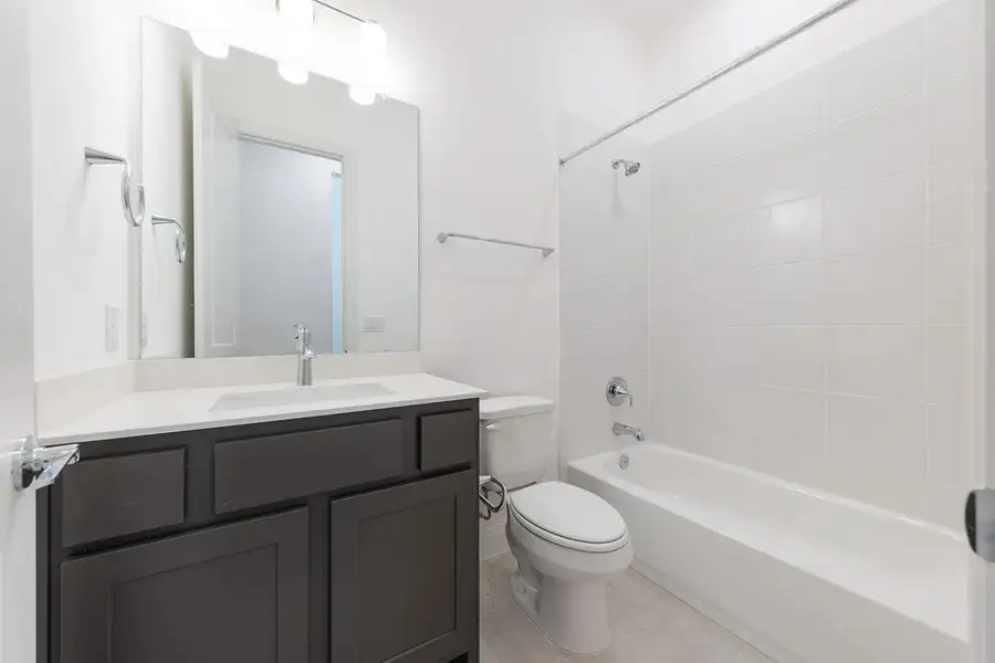 Bathroom featuring  shower combination and vanity