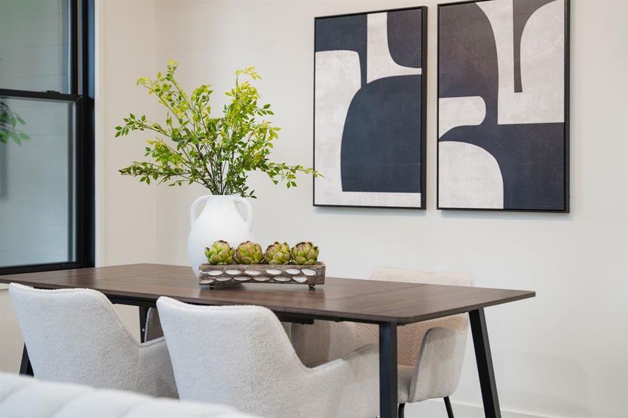 Revel in Sunday brunch bliss in this dining room, where the soft morning light and inviting atmosphere make it the ideal spot for leisurely breakfasts and joyful mid-morning gathering