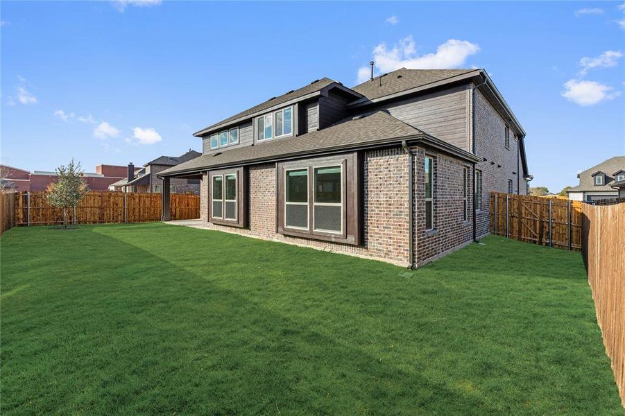 Exterior details and patio area of a home in West Crossing, Anna (Image 3). Exterior details and patio area of a home in West Crossing, Anna (Image 3).
