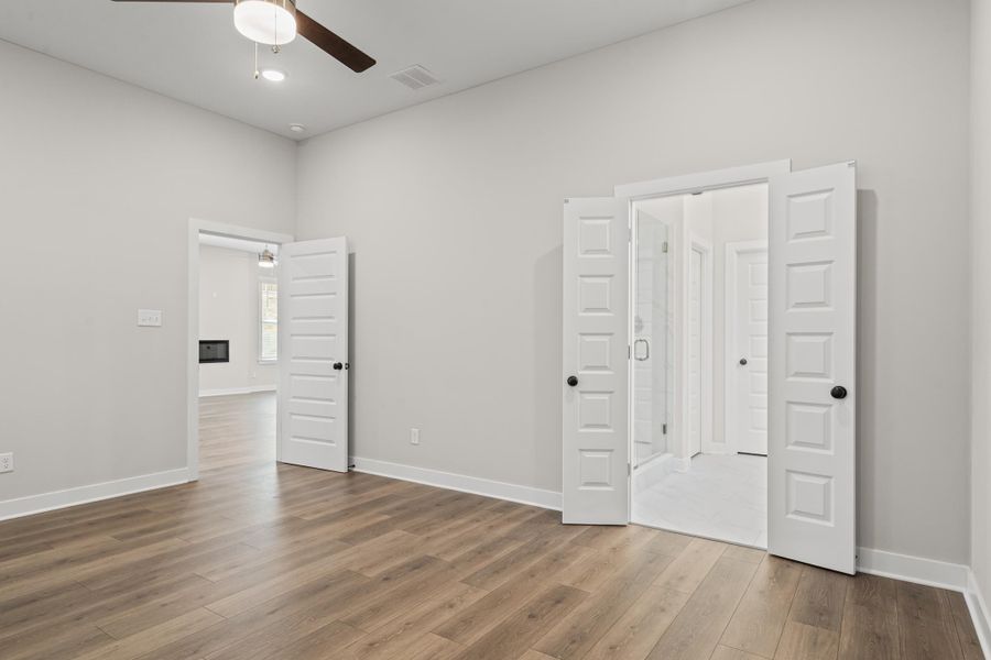 Unfurnished bedroom with wood finished floors, a ceiling fan, and recessed lighting