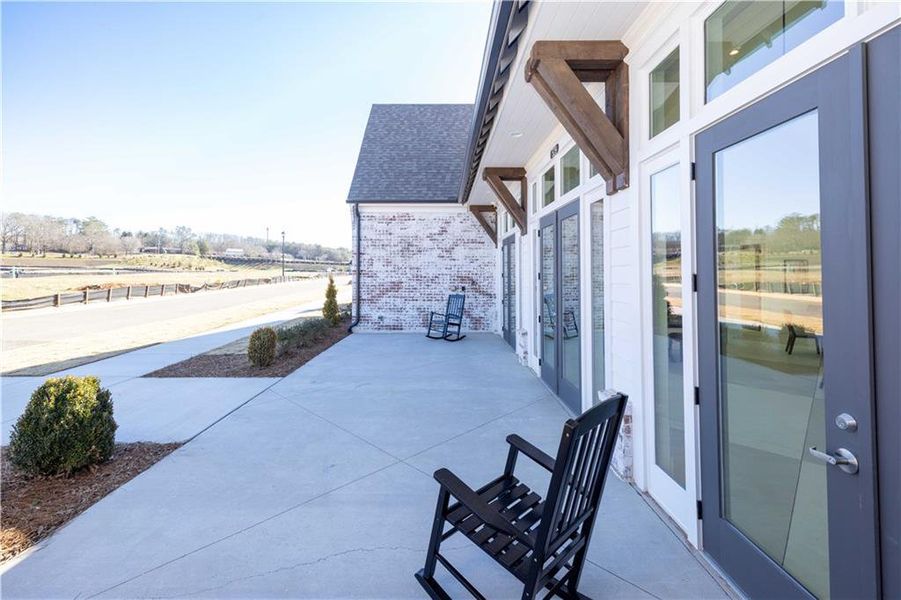 Front exterior of a new home in Promenade at Sawnee Village, Cumming, GA, highlighting curb appeal (Image 27).