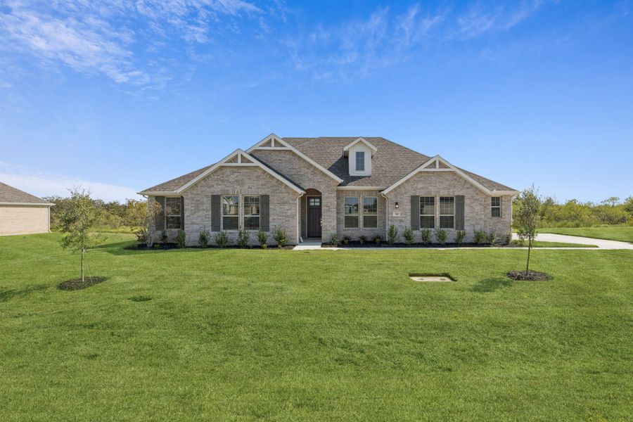 Front exterior of a new home in Ellis Ranch Estates, Waxahachie, TX, highlighting curb appeal (Image 1). Front exterior of a new home in Ellis Ranch Estates, Waxahachie, TX, highlighting curb appeal (Image 1).