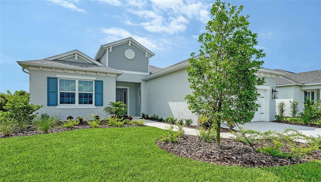 Front exterior of a new home in Canoe Creek, Parrish, FL, highlighting curb appeal (Image 1). Front exterior of a new home in Canoe Creek, Parrish, FL, highlighting curb appeal (Image 1).