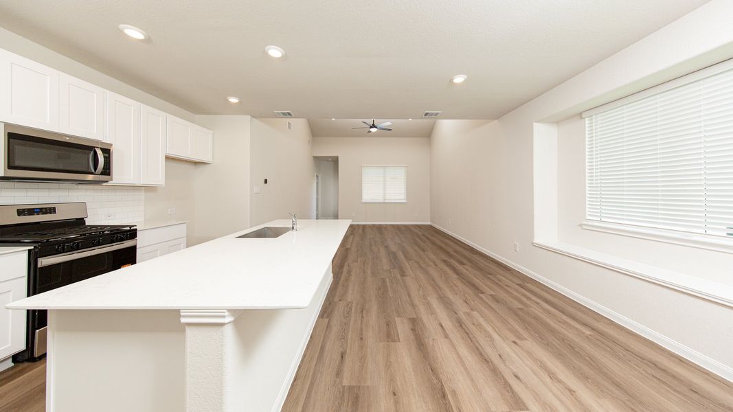 Kitchen and Dining Area to Family Room