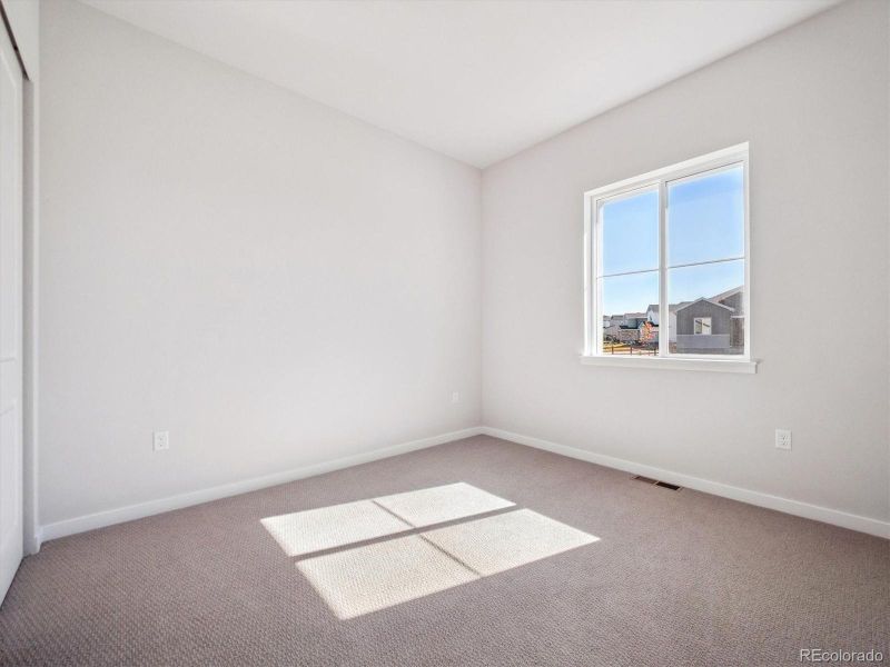 Spacious, unfurnished interior of a new home in Trails at Smoky Hill, Parker (Image 19).