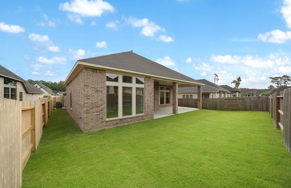 Exterior details and patio area of a home in Audubon 60', Magnolia (Image 4).