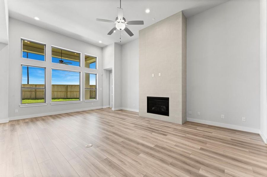 Family Room with Gas Log Fireplace and Floor Outlet