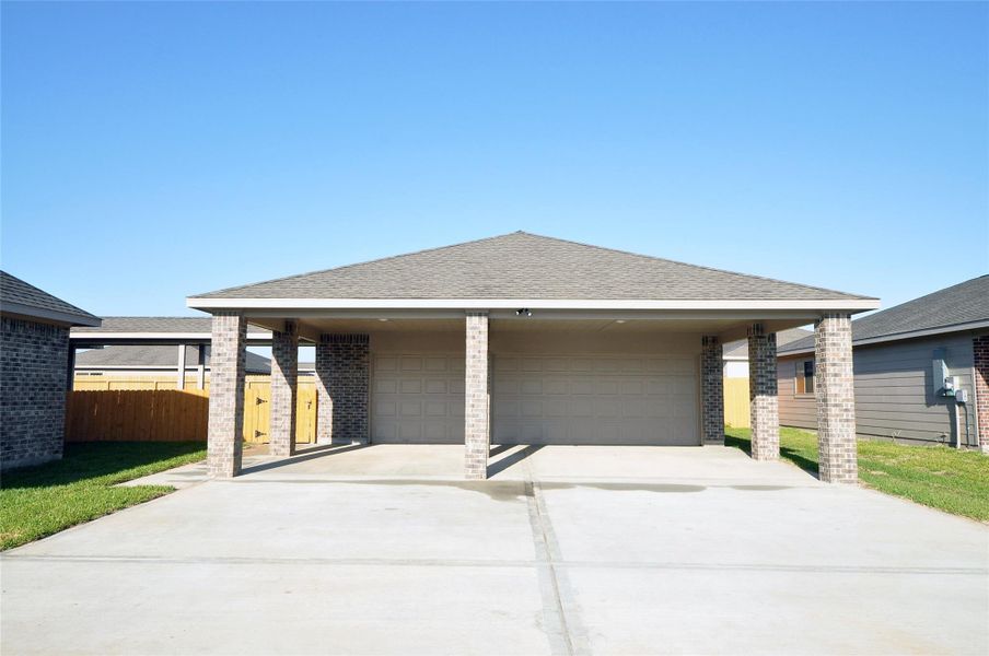 Front exterior of a new home in Pedregal, League City, TX, highlighting curb appeal (Image 24).