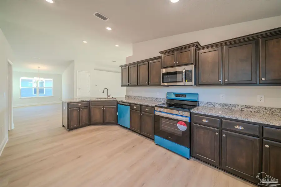 Furnished interior view inside a new home in Pine Top, Cantonment (Image 4).