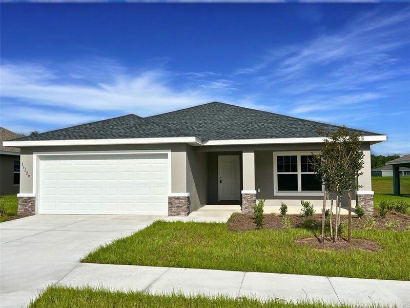 Front exterior of a new home in , Dunnellon, FL, highlighting curb appeal (Image 1). Front exterior of a new home in , Dunnellon, FL, highlighting curb appeal (Image 1).