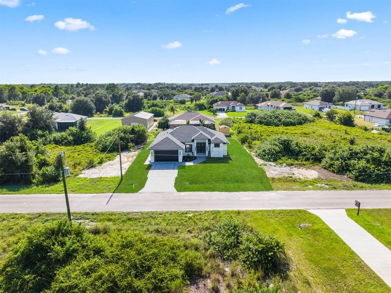 Front exterior of a new home in , Lehigh Acres, FL, highlighting curb appeal (Image 29). Front exterior of a new home in , Lehigh Acres, FL, highlighting curb appeal (Image 29).