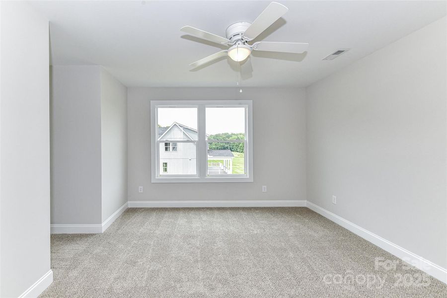 Secondary Bedroom on upper level with ceiling fan/light! Secondary Bedroom on upper level with ceiling fan/light!