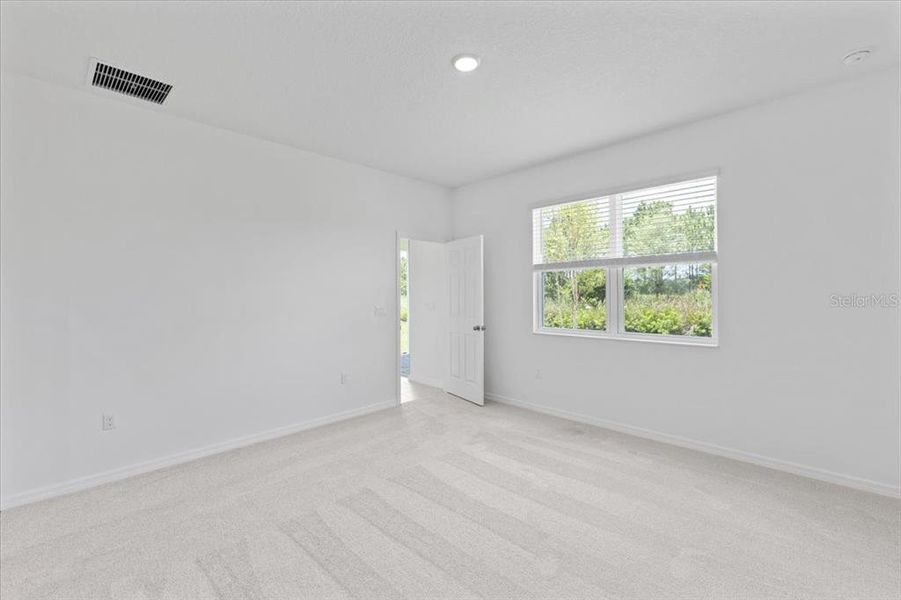 Spacious, unfurnished interior of a new home in Highfield at Twisted Oaks, Wildwood (Image 12).
