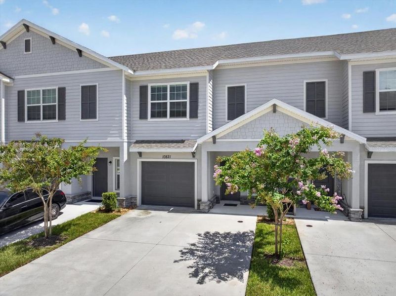 Front exterior of a new home in Calusa Creek, Riverview, FL, highlighting curb appeal (Image 23).