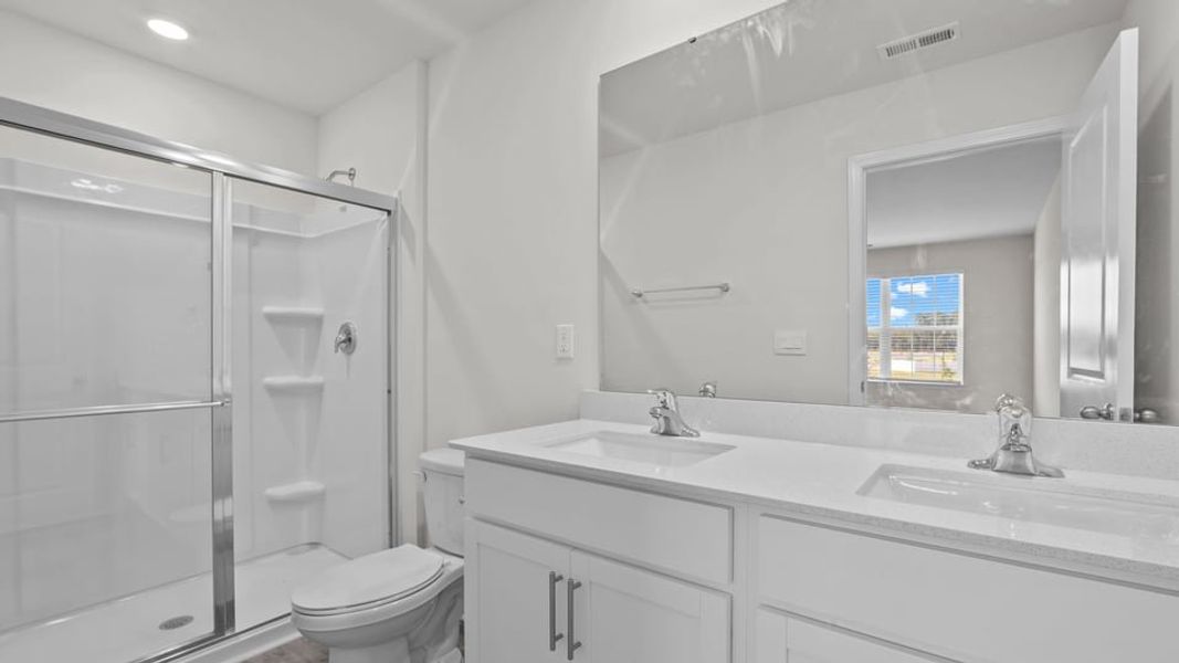 Furnished interior view inside a new home in The Townes at Ridgewood Farms, Winterville (Image 10).