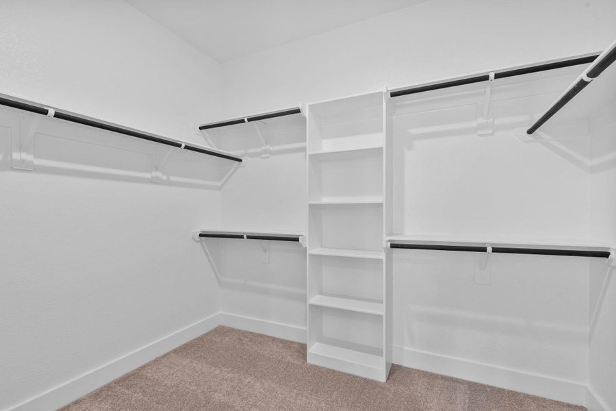 Thoughtfully laid out, the closet includes multiple hanging areas, built-in shelving, and ample storage options to keep clothing, shoes, and accessories neatly organized. Thoughtfully laid out, the closet includes multiple hanging areas, built-in shelving, and ample storage options to keep clothing, shoes, and accessories neatly organized.
