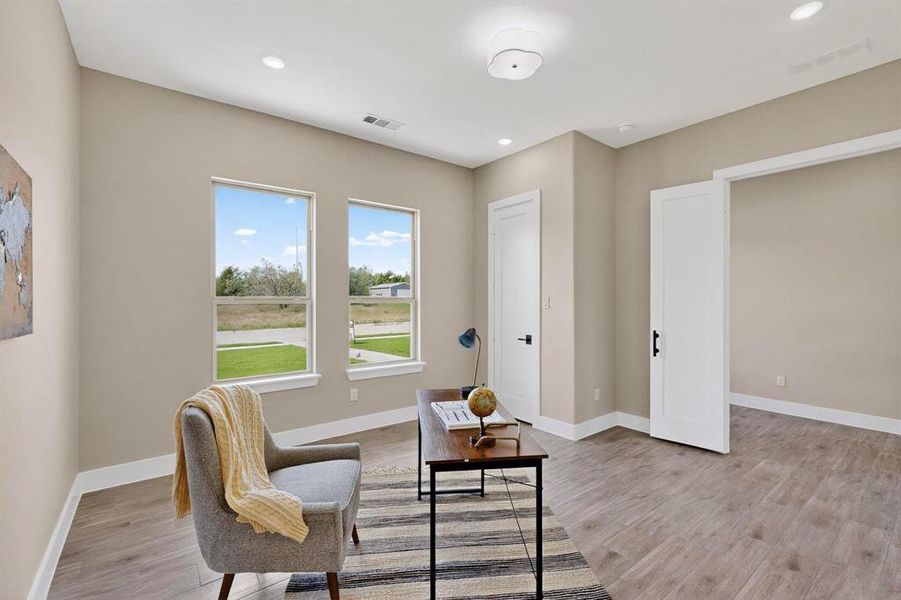 Sitting room featuring a desk, recessed lighting, and light wood-style floors