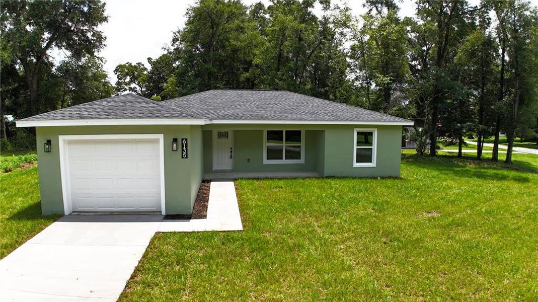 Front exterior of a new home in , Ocala, FL, highlighting curb appeal (Image 2). Front exterior of a new home in , Ocala, FL, highlighting curb appeal (Image 2).