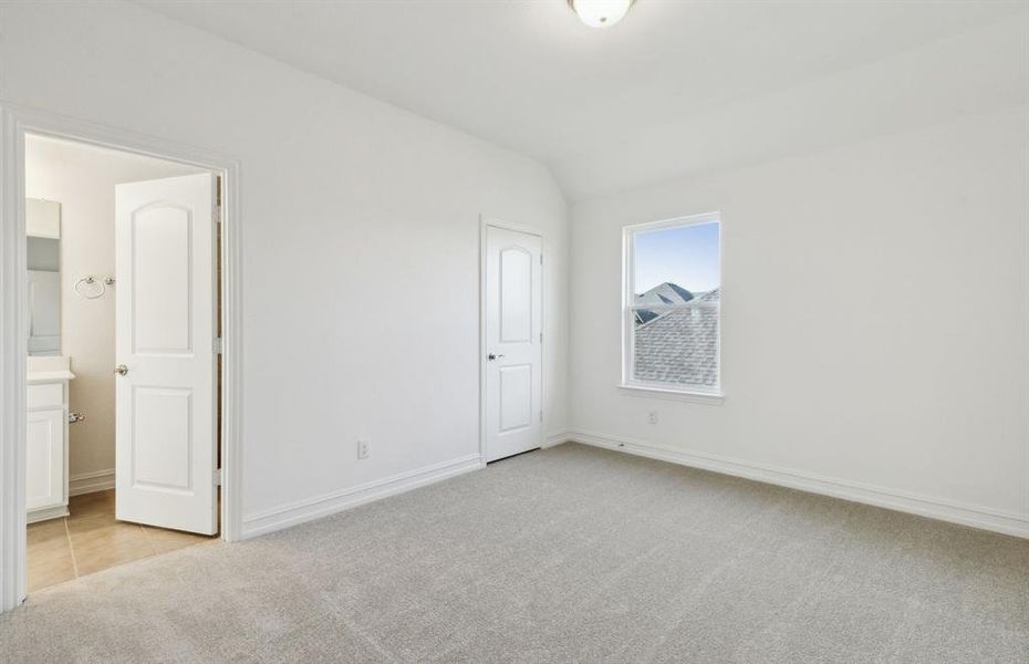 Spacious secondary bedroom with ample closet space  *real home pictured