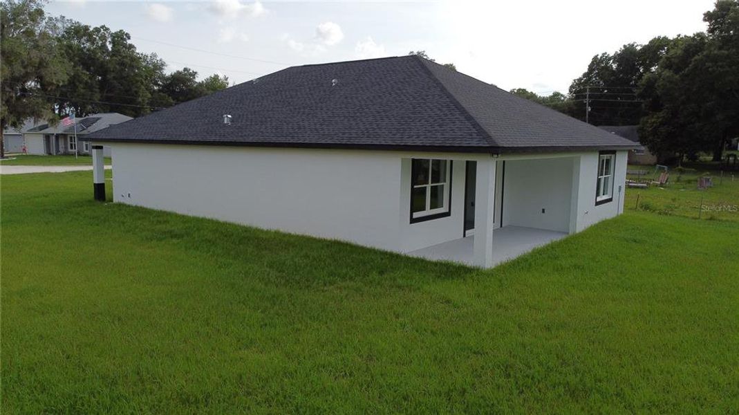 Exterior details and patio area of a home in , Summerfield (Image 31).