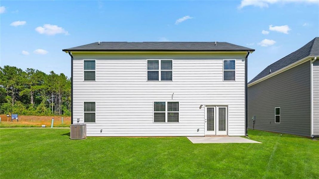 Exterior details and patio area of a home in Teamon Pointe, Griffin (Image 2).