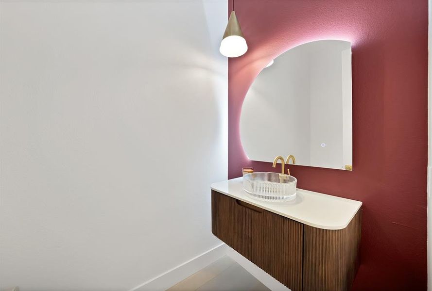 Bathroom with vanity and baseboards