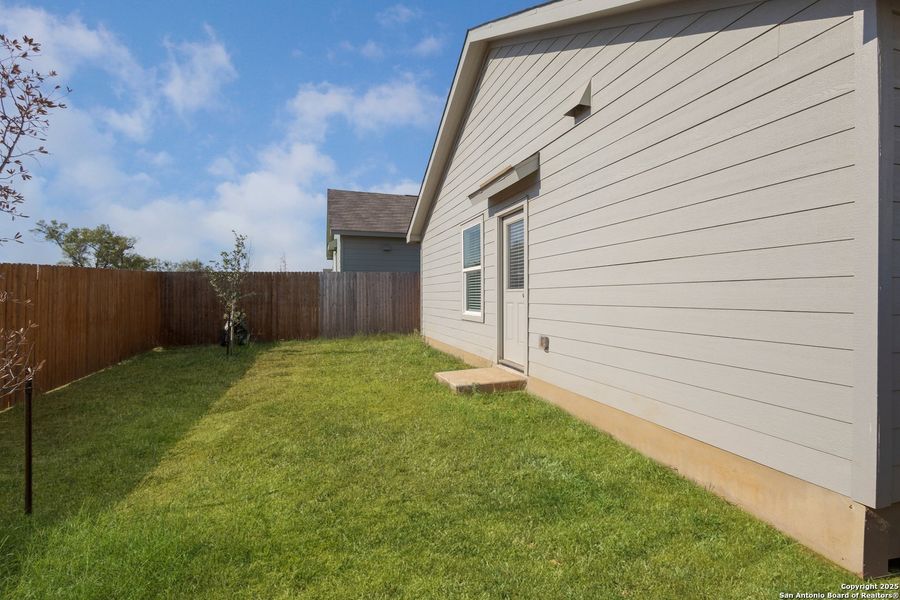 Exterior details and patio area of a home in Ruby Crossing: Cottage Collection, San Antonio (Image 4).