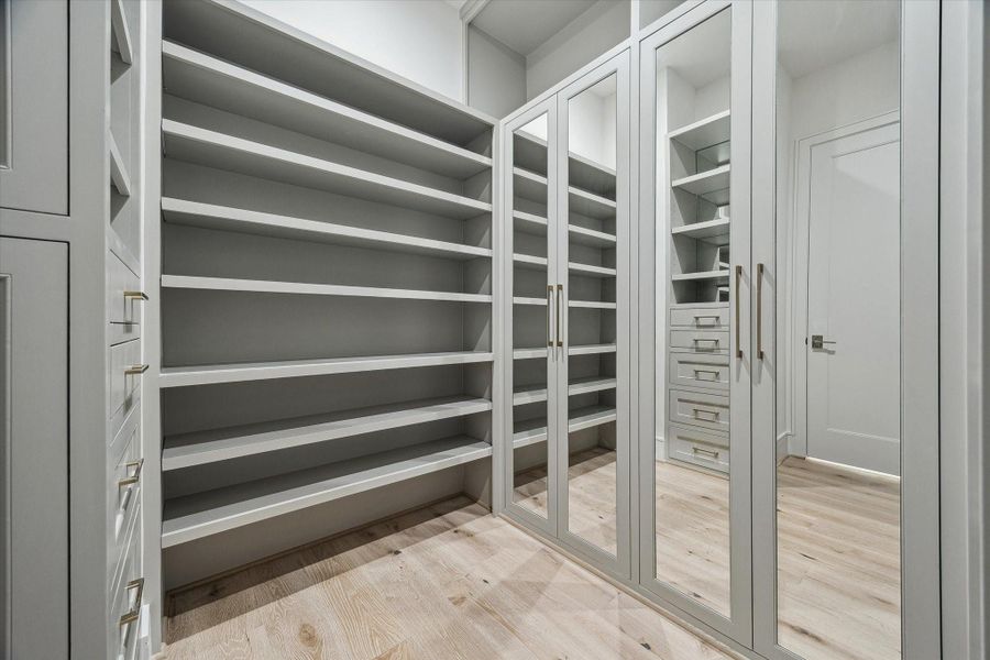 The second primary closet features the same outstanding features as the first. So much storage and crisp, clean details.