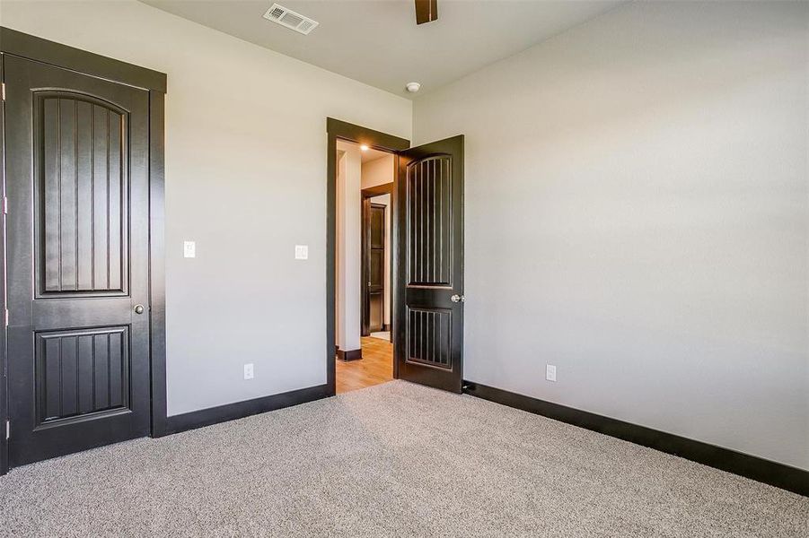 Unfurnished bedroom featuring light carpet