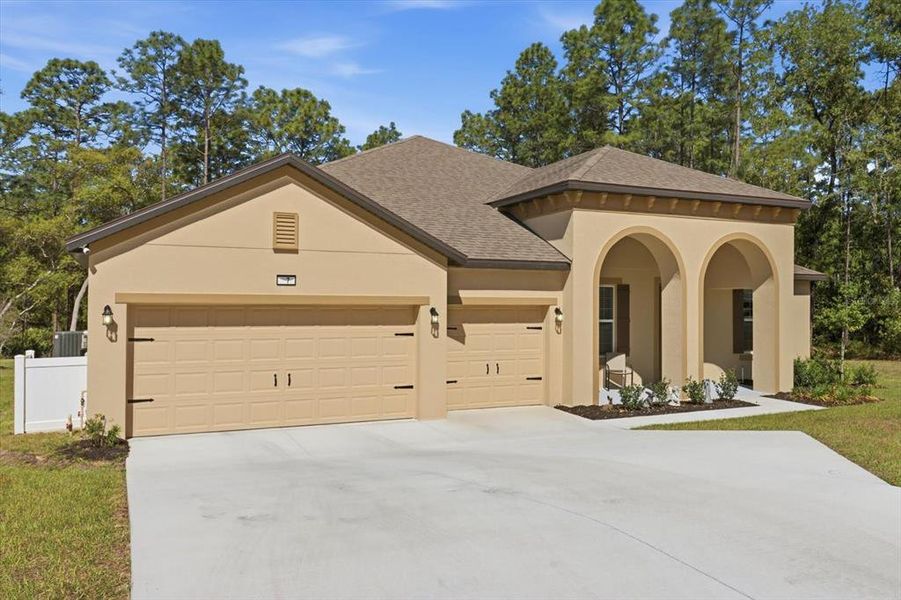 Front exterior of a new home in , Homosassa, FL, highlighting curb appeal (Image 25).
