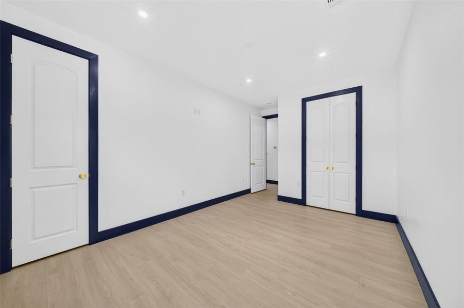 Additional bedroom view showcasing generous space and clean contemporary finishes