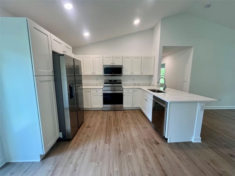 Spacious kitchen with plenty of storage.