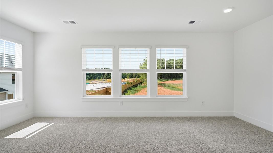 Highly skilled design shines in this elegant, restful primary suite near Downtown Fountain Inn
