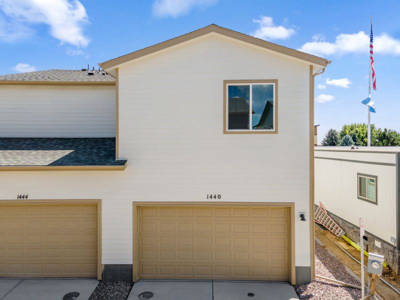 Front exterior of a new home in Spring Valley, Greenwood Village, CO, highlighting curb appeal (Image 24).