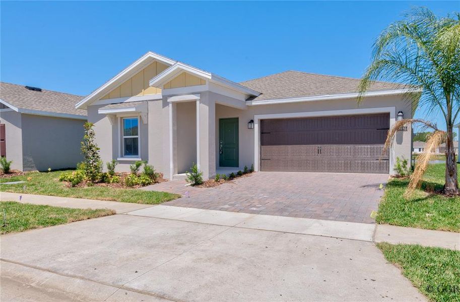 Front exterior of a new home in Knightsbridge, Kissimmee, FL, highlighting curb appeal (Image 19). Front exterior of a new home in Knightsbridge, Kissimmee, FL, highlighting curb appeal (Image 19).