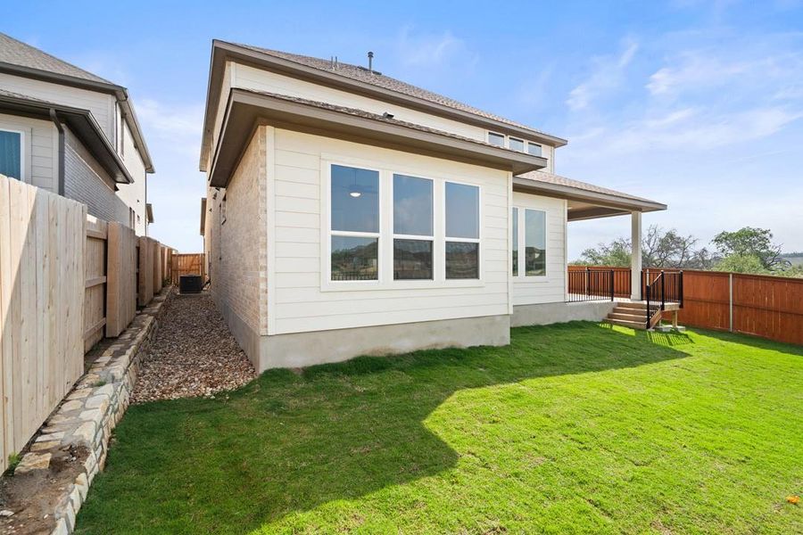 Front exterior of a new home in Park Collection at Lariat, Liberty Hill, TX, highlighting curb appeal (Image 22). Front exterior of a new home in Park Collection at Lariat, Liberty Hill, TX, highlighting curb appeal (Image 22).