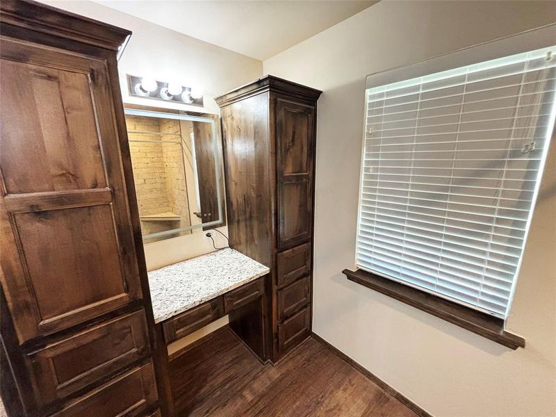 Bathroom with dark wood-type flooring and vanity Bathroom with dark wood-type flooring and vanity